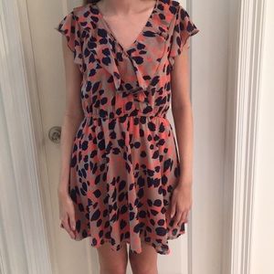 Tan flowy dress with a navy and pink pattern